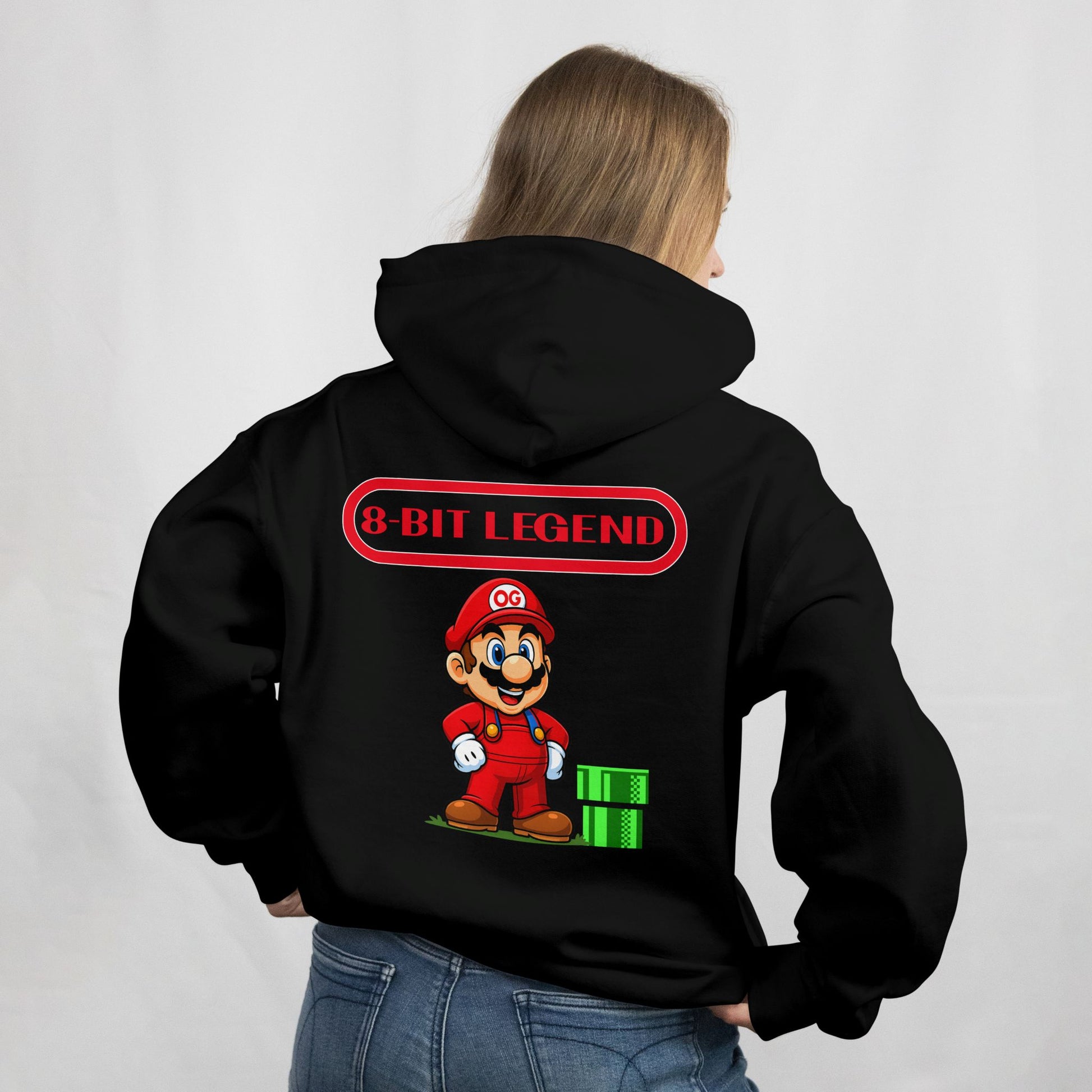 Person wearing a black hoodie with '8-Bit Legend' design on the back