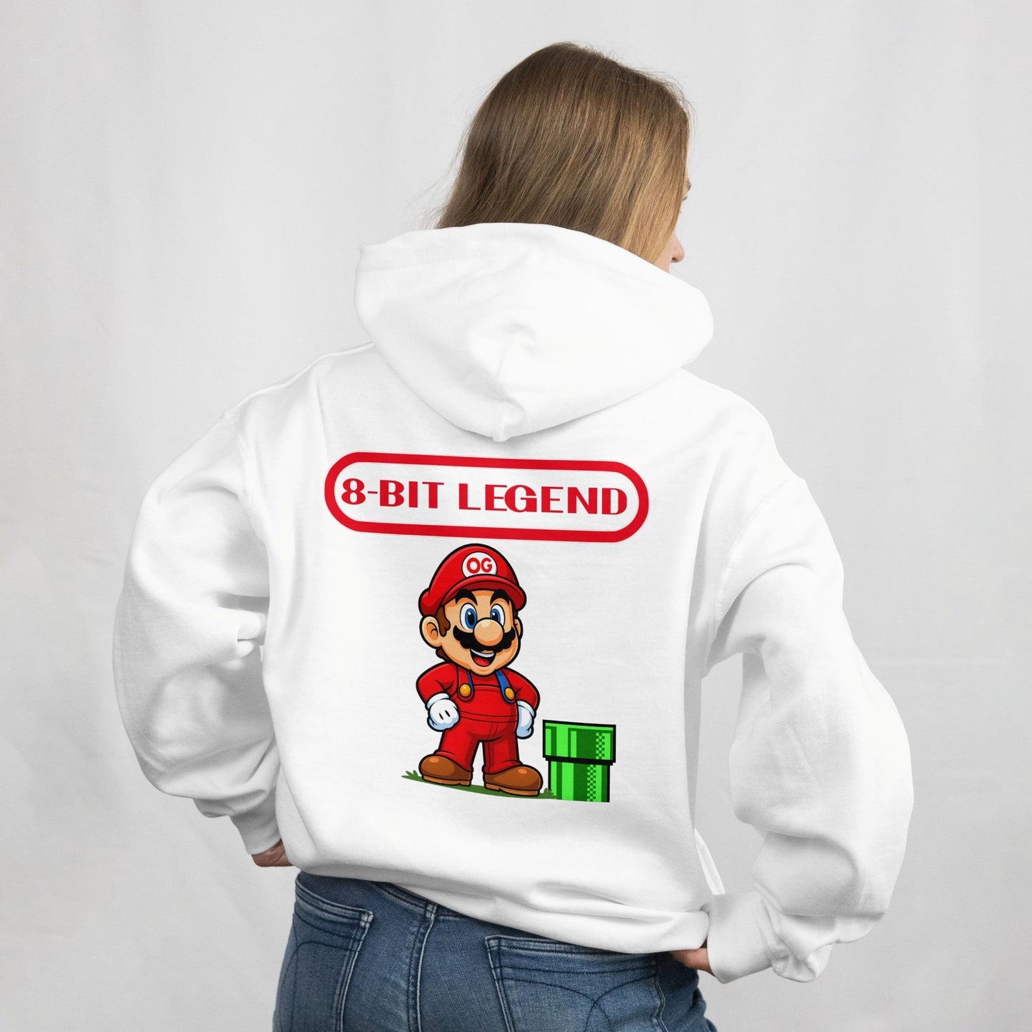 Person wearing a white hoodie with a character and '8-Bit Legend' text on the back.