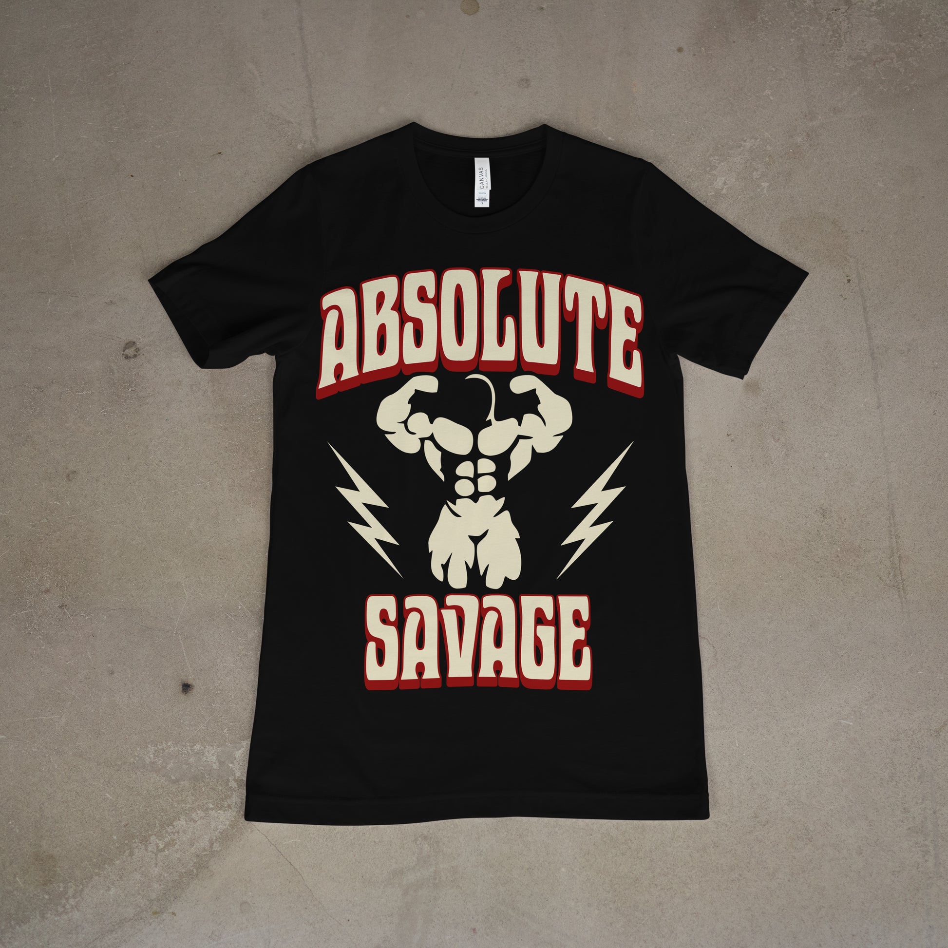 Black unisex crew neck t-shirt with the text 'Absolute Savage' printed in white, surrounded by a graphic of a flexing muscle man, with red and yellow accents.