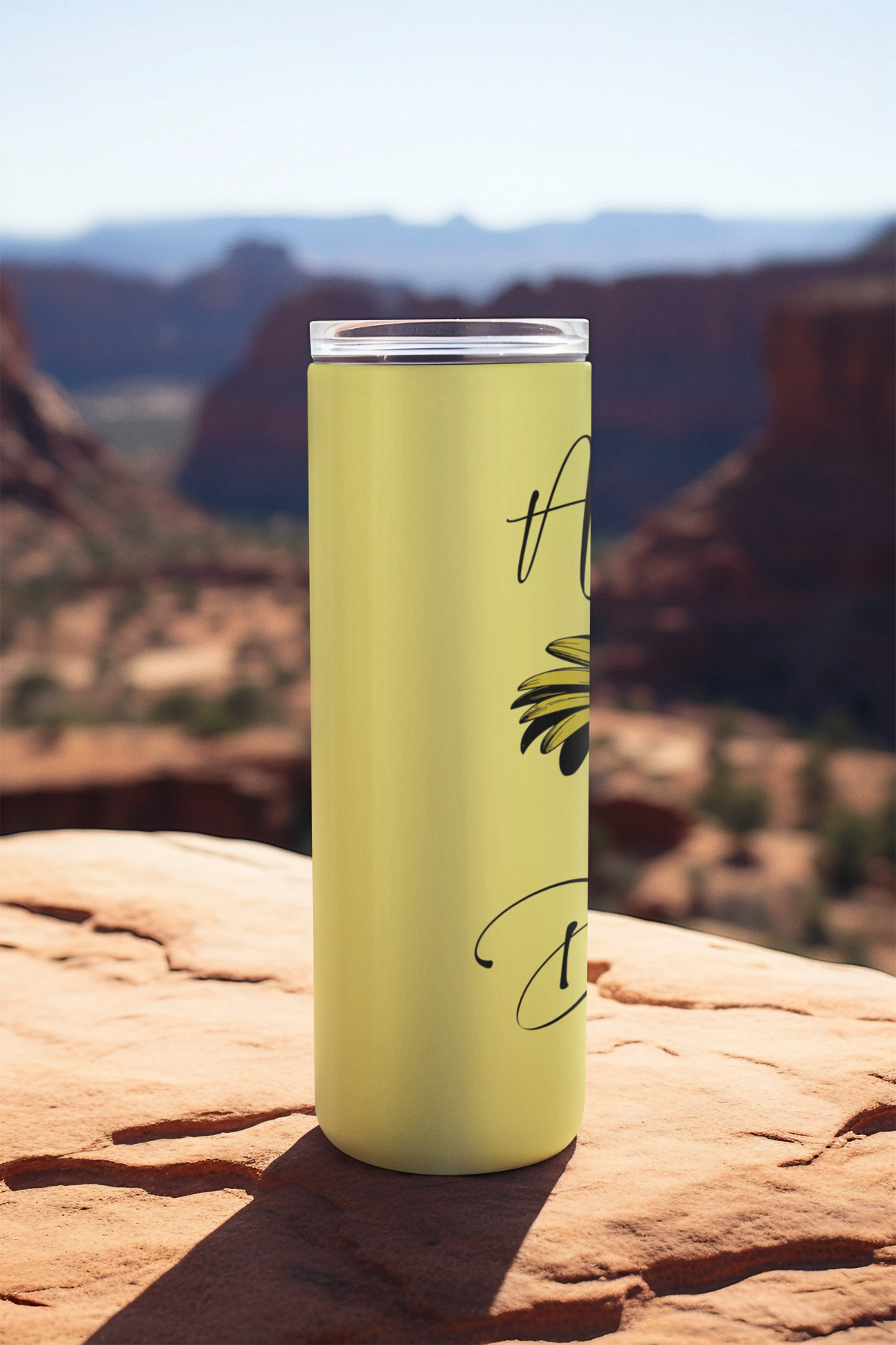 Side angle of 20oz yellow daisy birth flower tumbler