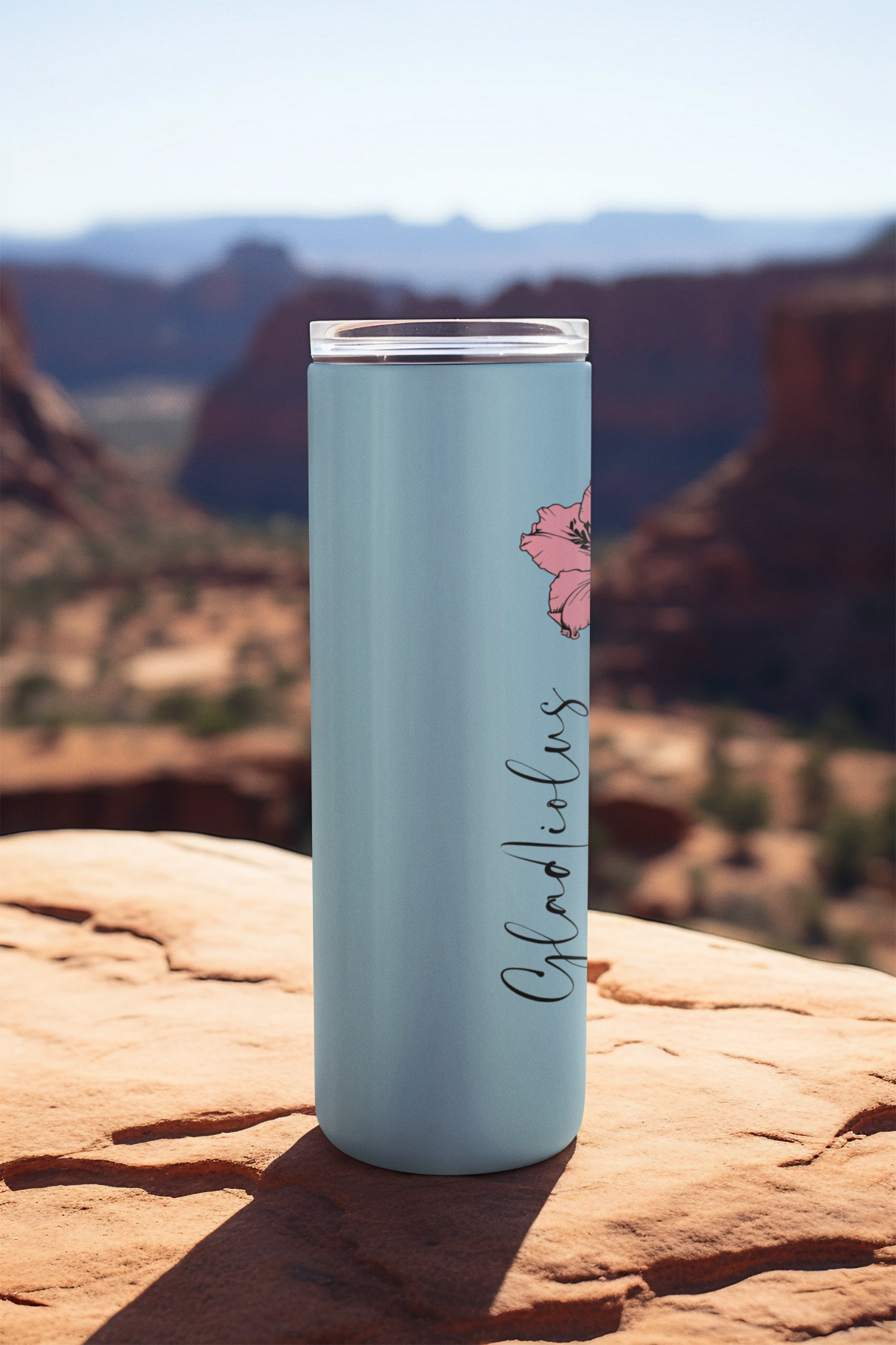 Side view of pink floral tumbler outdoors