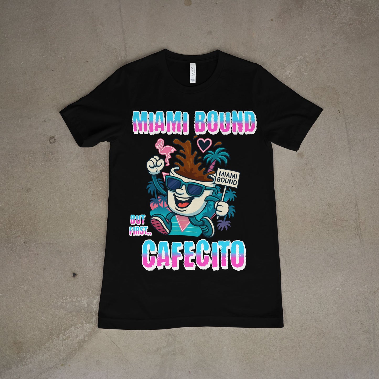 Black t-shirt with colorful graphic and text on a beige surface