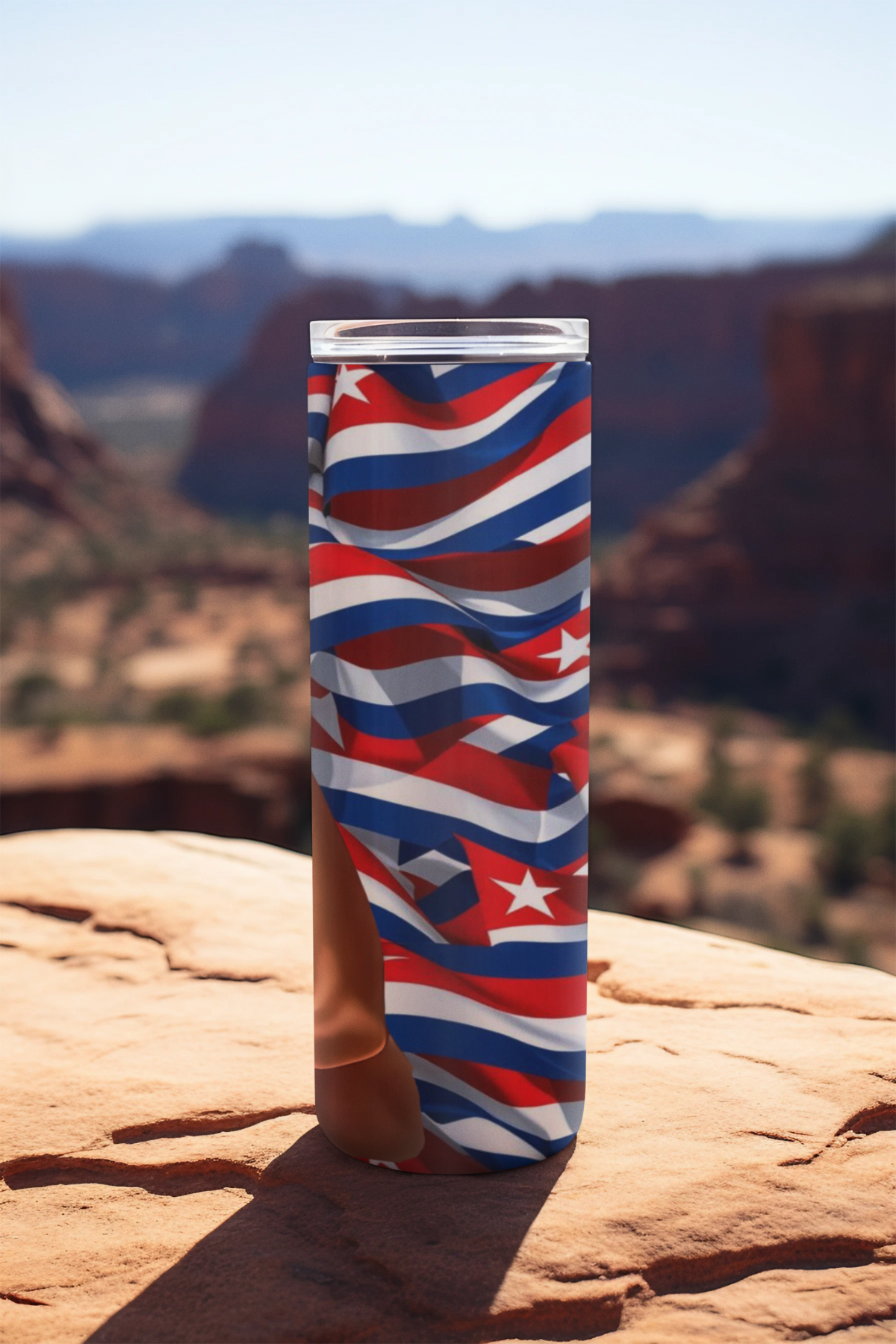 Custom Cuban-inspired 20oz stainless steel tumbler featuring “Maria La Valiente” design with a strong Latina character in a red bandana, placed on a scenic outdoor background. Side view