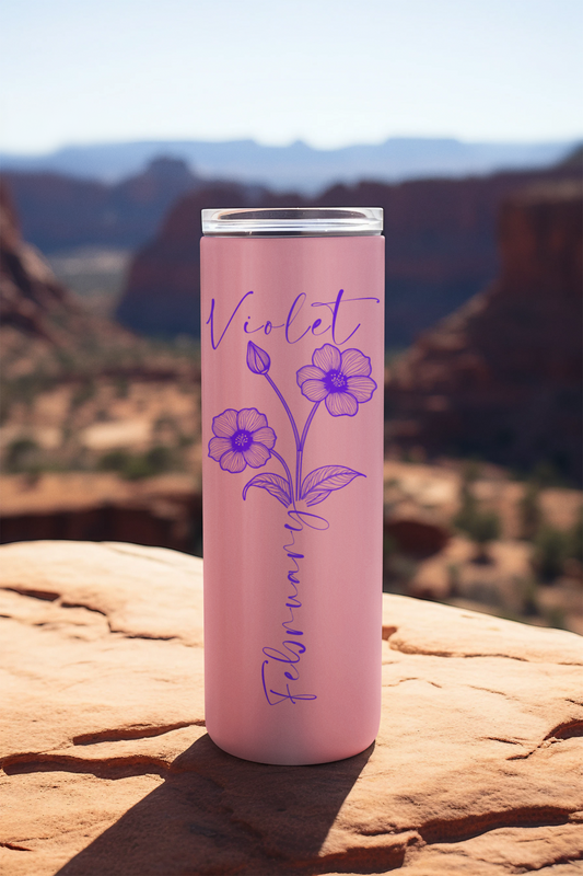 February violet birth flower tumbler on scenic rock ledge