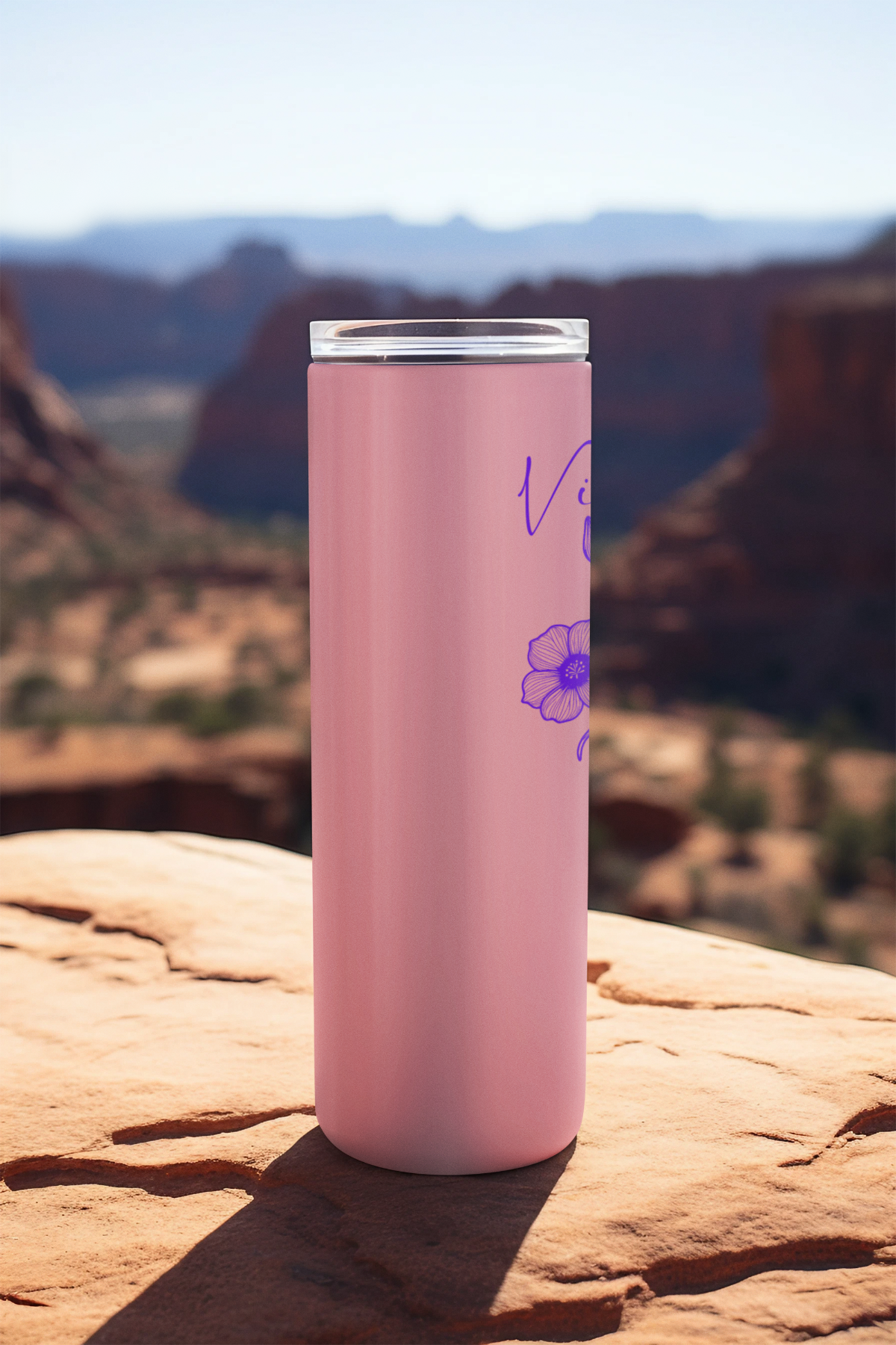 Side view of pink tumbler with violet flower design