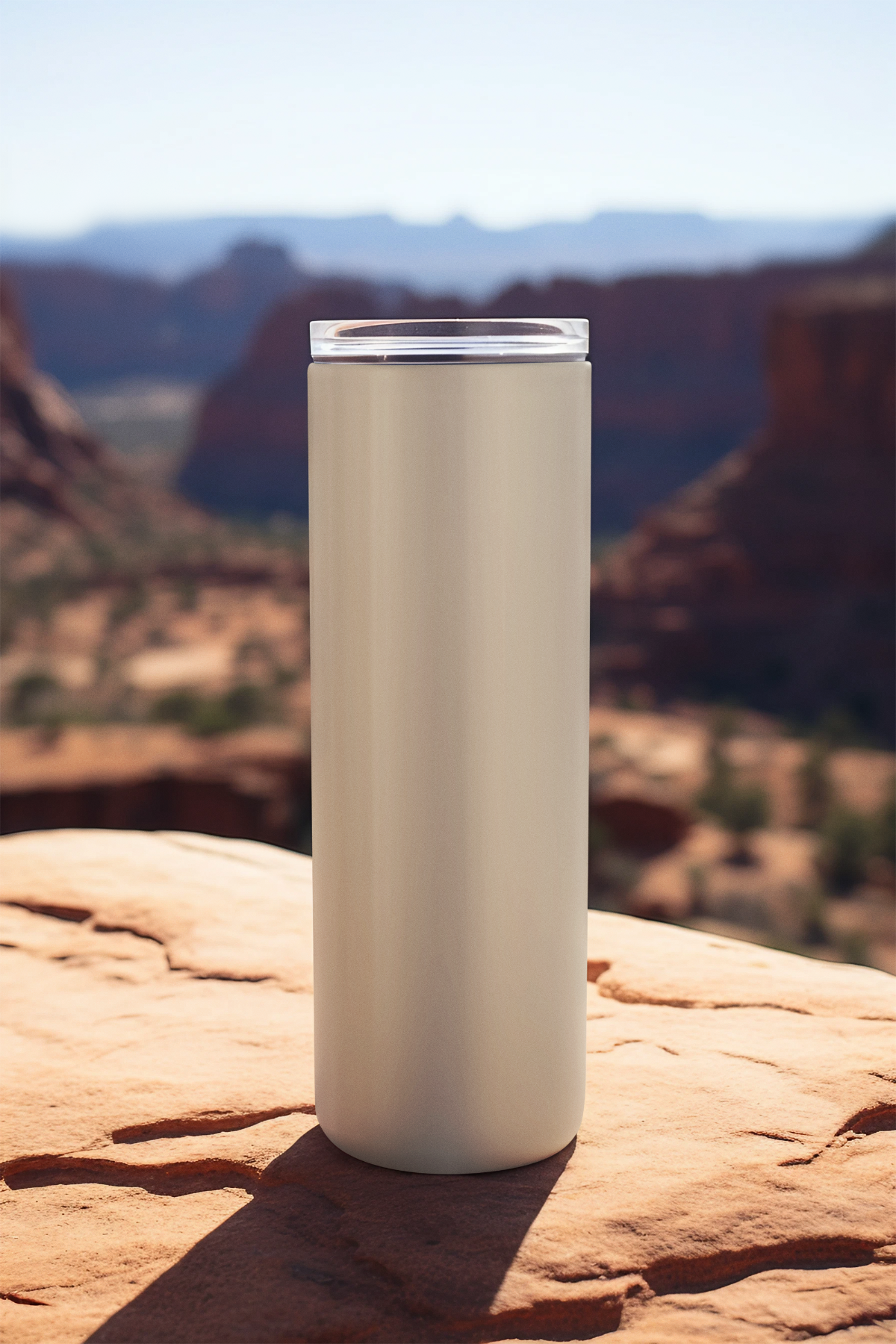 Full vertical view of June tumbler with lid, featuring honeysuckle artwork on ivory background outdoors