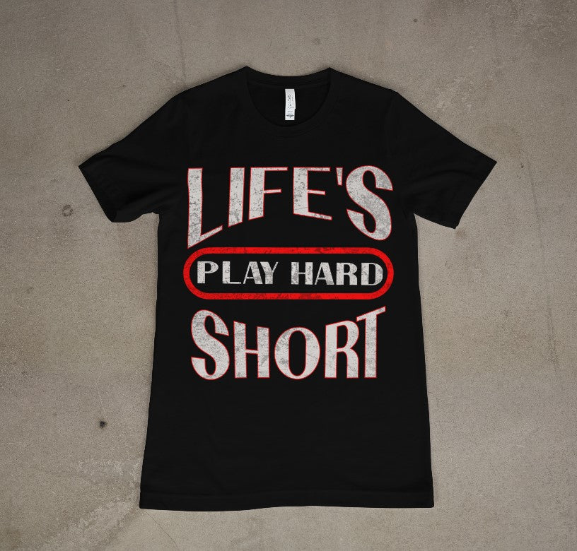 A black crew neck t-shirt with the text 'LIFE'S PLAY HARD SHORT' printed in white and red on the front.