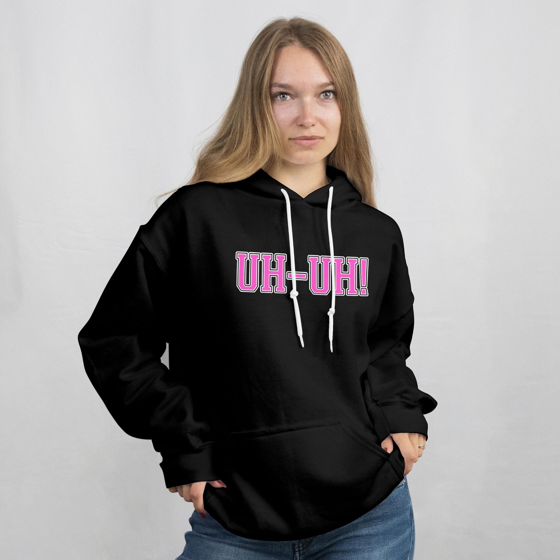 Person wearing a black hoodie with 'UH-UH!' text on a plain background