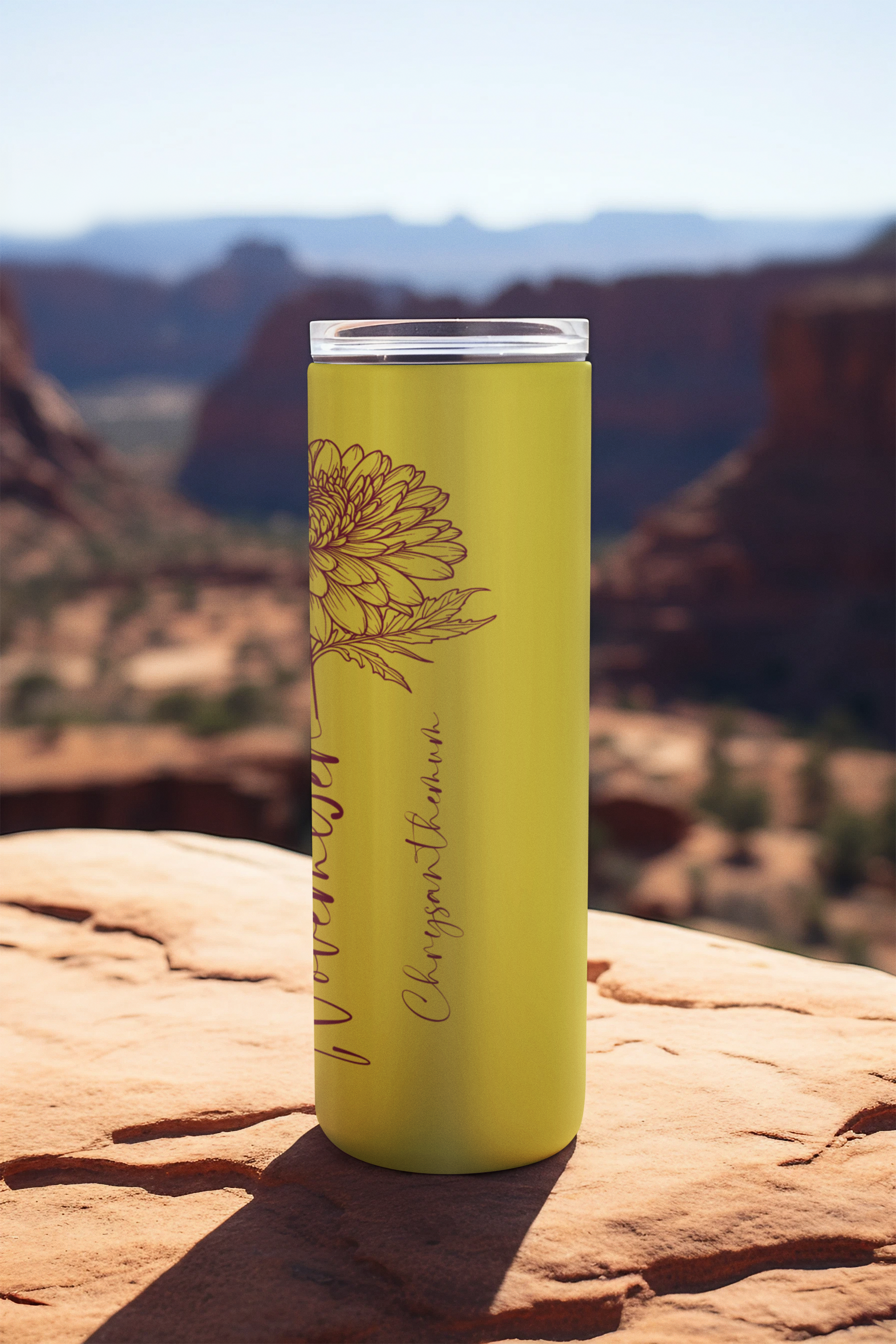 Side angle of November skinny tumbler featuring delicate yellow flower print