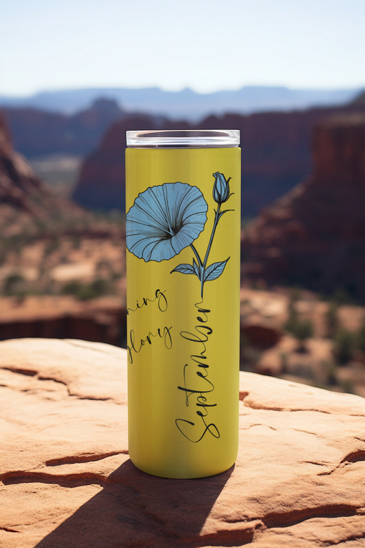 Front view of September tumbler with sky blue floral design on bright yellow background