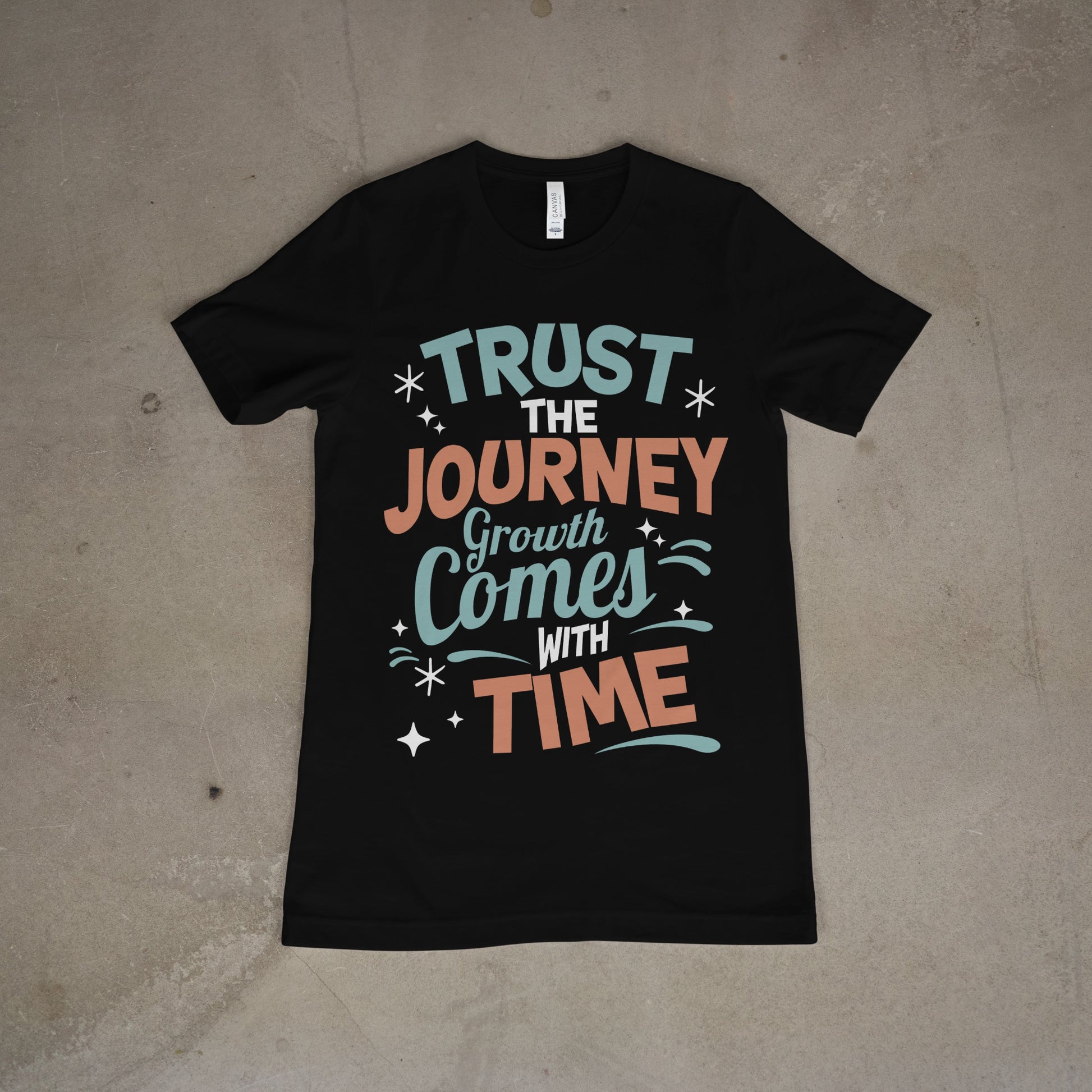 Black t-shirt with inspirational graphic text “Trust the Journey, Growth Comes with Time”