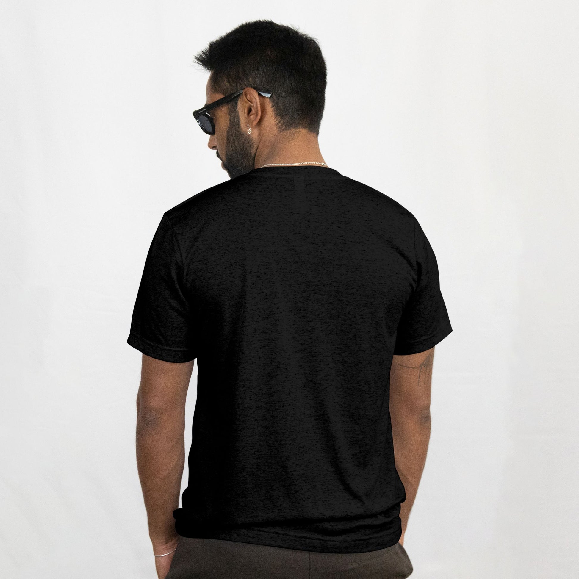 Man wearing a black t-shirt on a white background