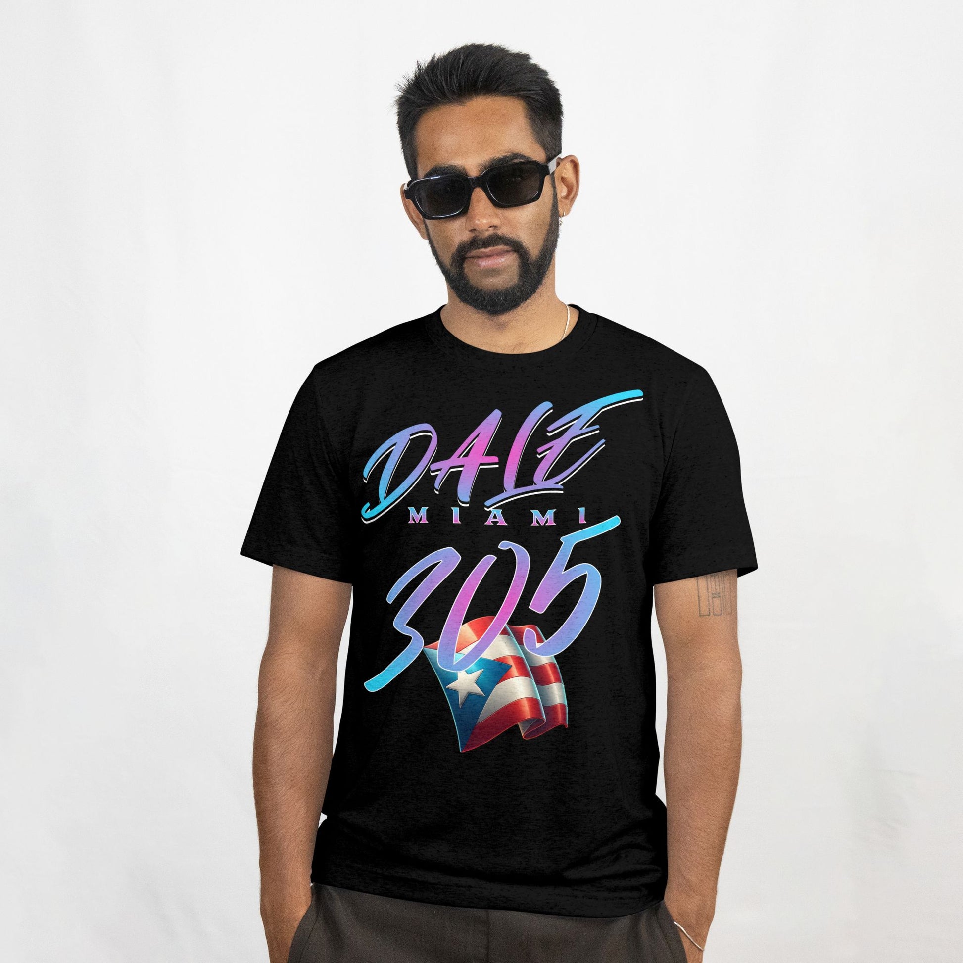 Man wearing a black t-shirt with colorful text and a flag design on a white background