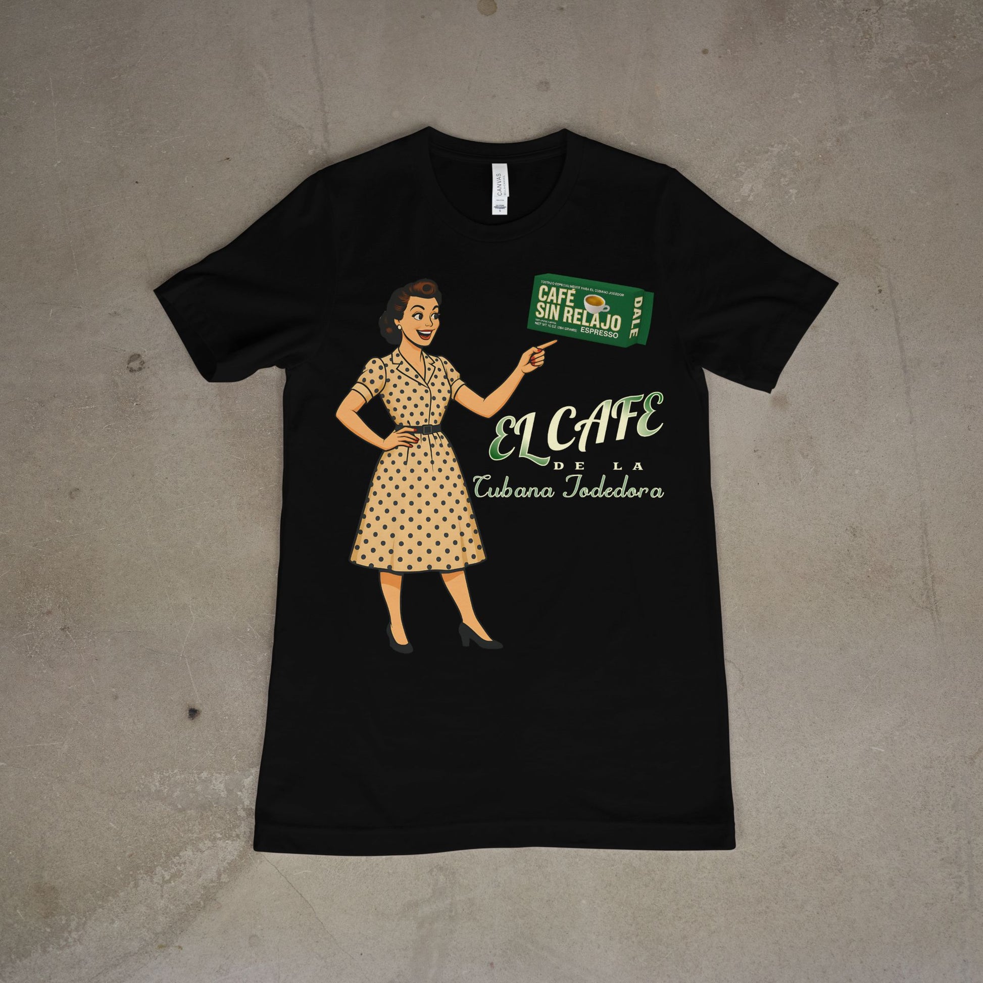 Black t-shirt with a graphic of a woman holding a coffee bag and 'El Cafe' text on a concrete floor.