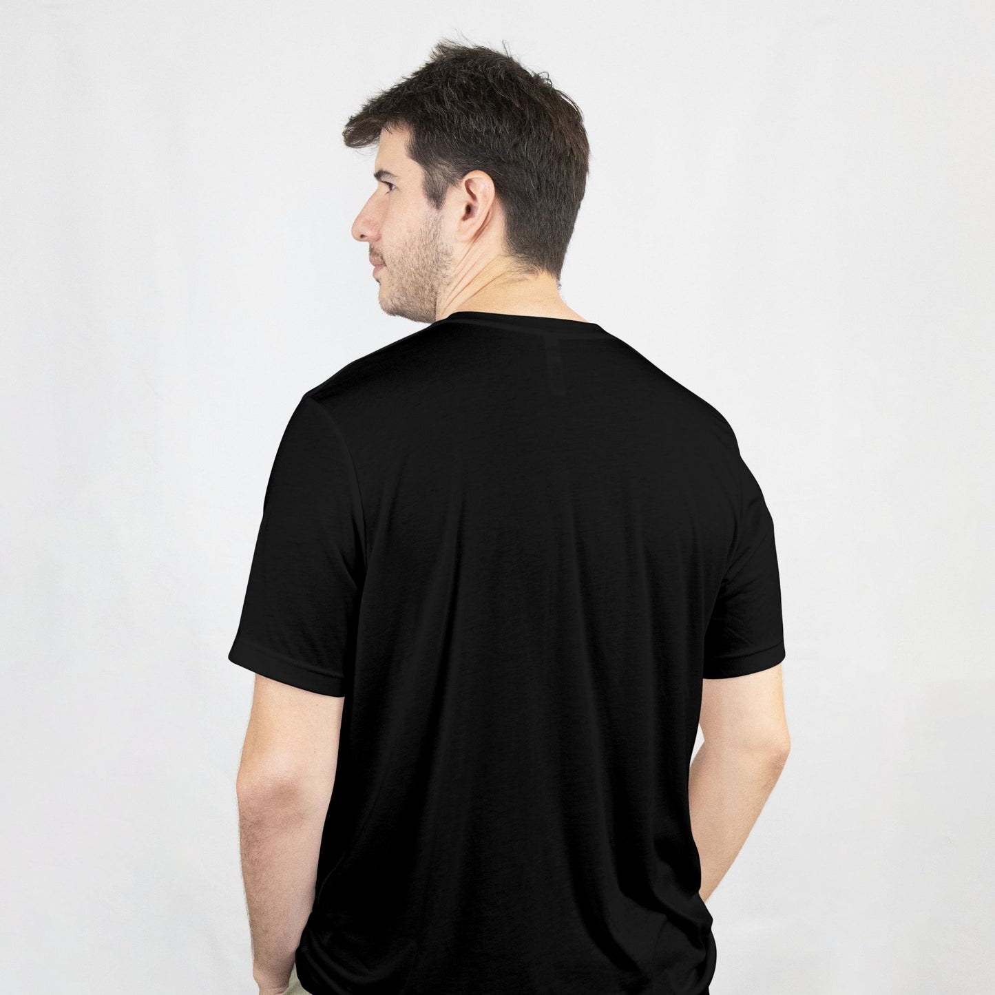 Man wearing a black t-shirt against a white background