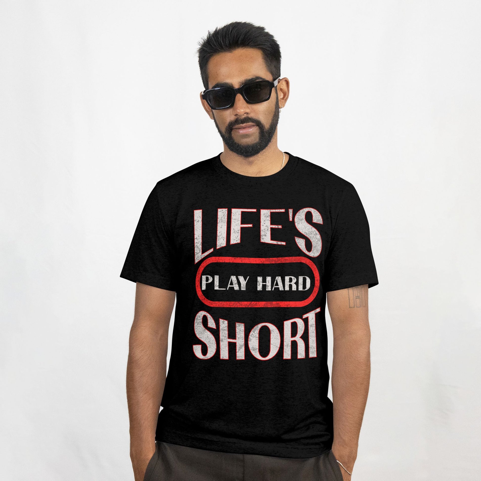 Man wearing a black t-shirt with 'LIFE'S PLAY HARD SHORT' text on a white background