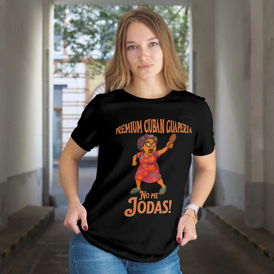 Person wearing a black t-shirt with a graphic design and text in an indoor setting. Text on shirt reads Premium Cuban Guaperia