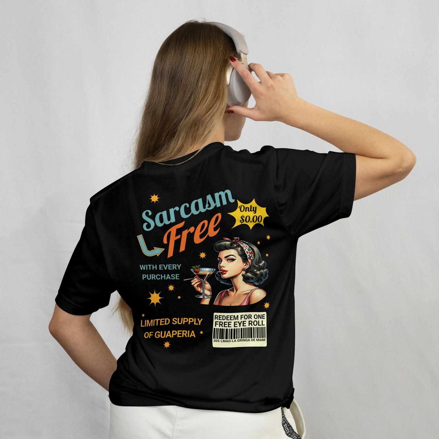 Person wearing a black t-shirt with a graphic design on the back, featuring text and an illustration.