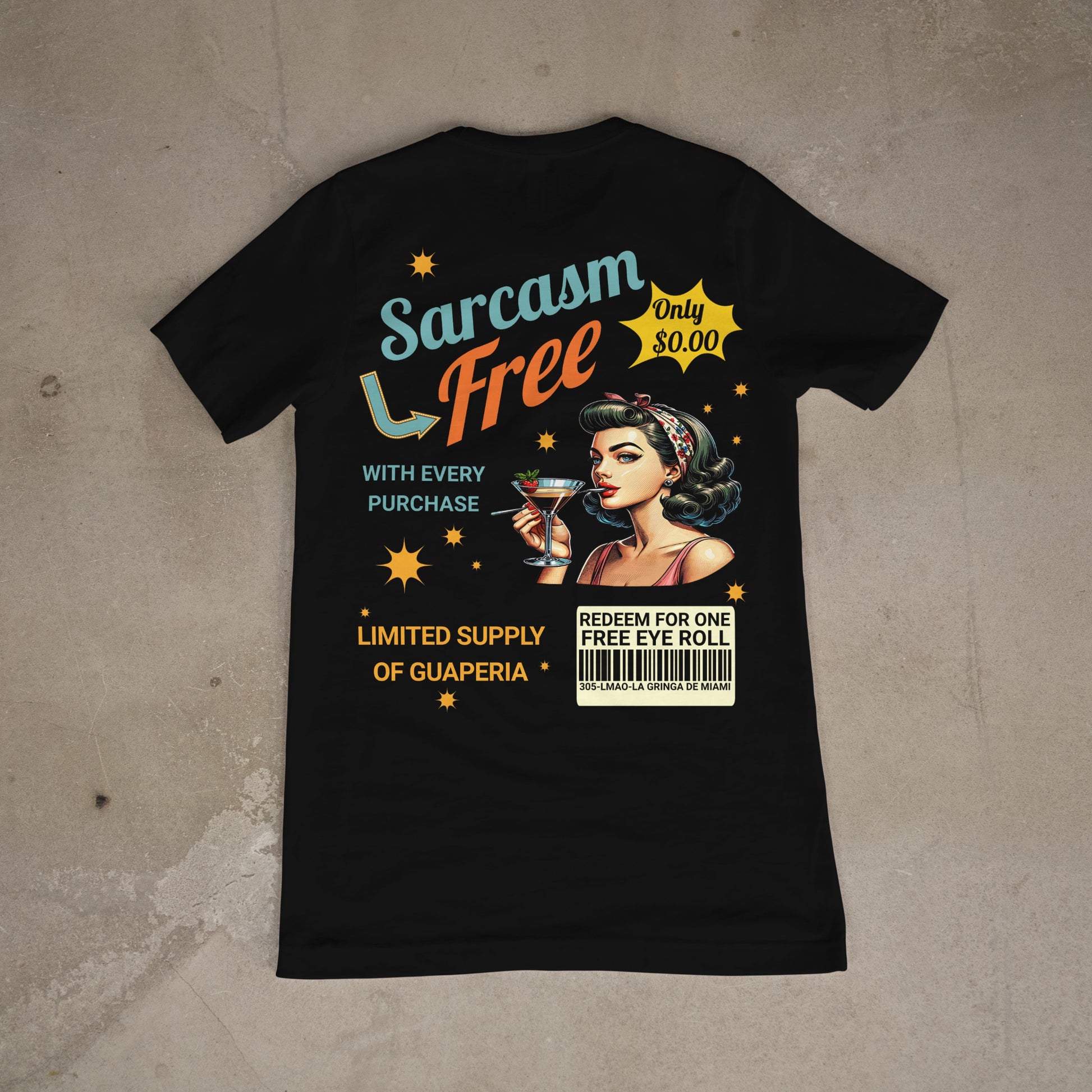 Black t-shirt with a graphic design featuring a woman holding a cocktail on a concrete floor.