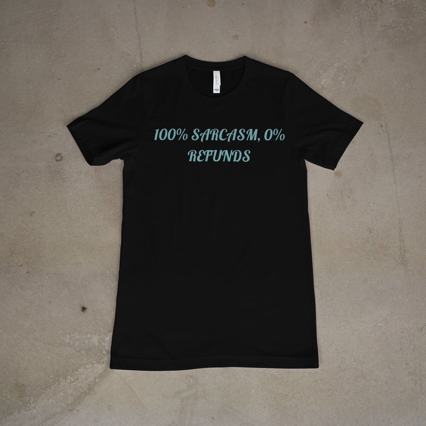 Black t-shirt with white text on a beige surface