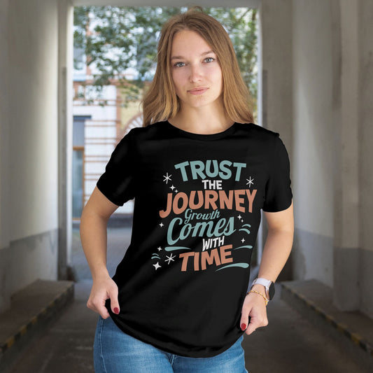 Person wearing a black t-shirt with motivational quote in an indoor setting