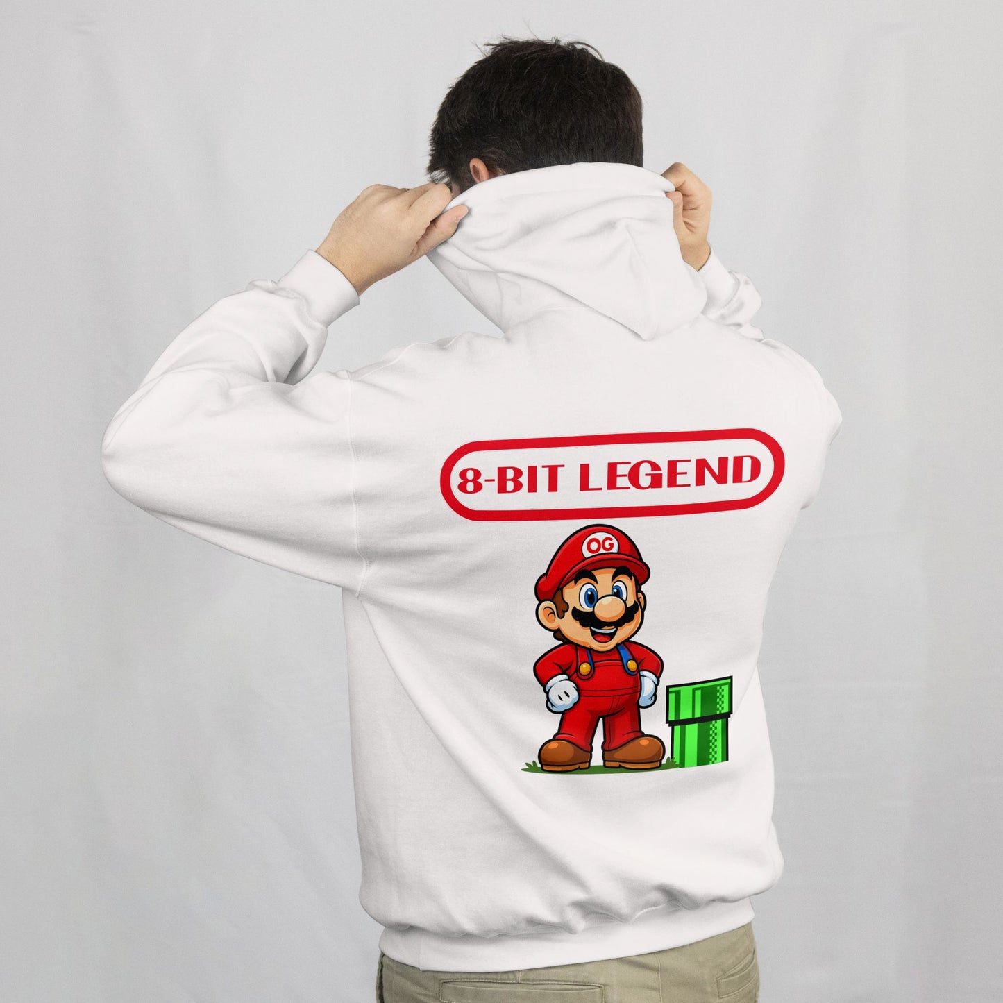 Person wearing a white hoodie with '8-Bit Legend' design on the back