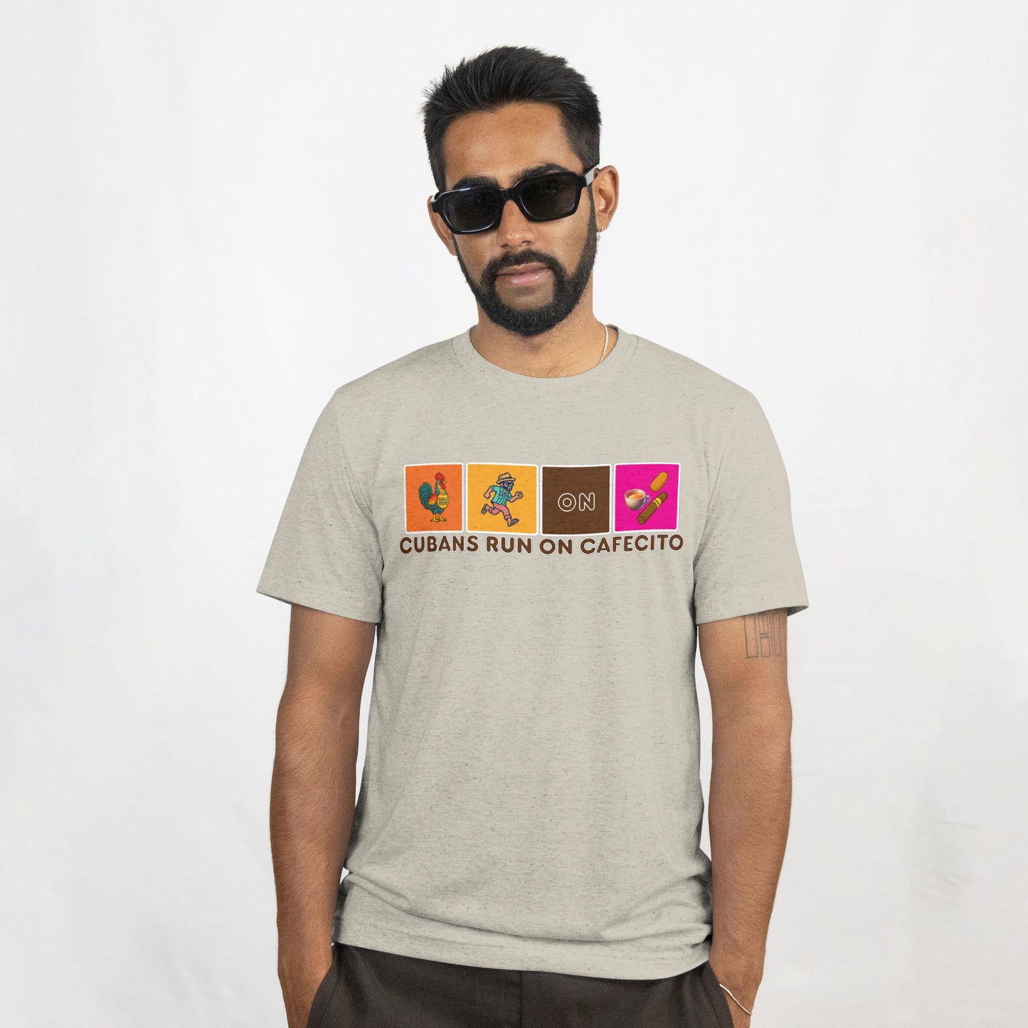 Man wearing a gray t-shirt with colorful graphic design on a white background