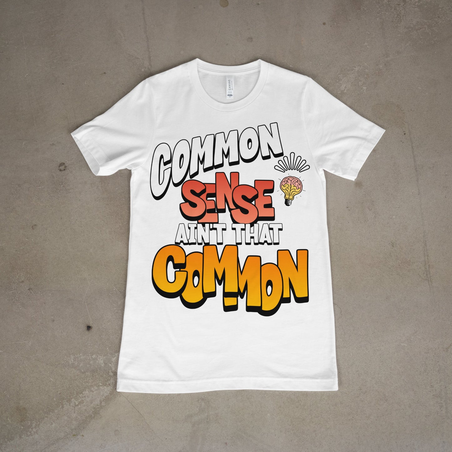 White t-shirt with fun typography reading “Common Sense Ain’t That Common”