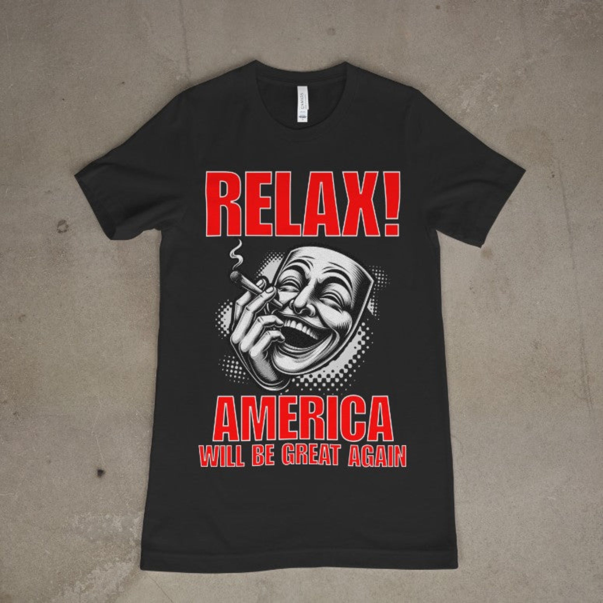 "Black graphic t-shirt featuring a bold red 'RELAX!' text above a stylized laughing face with a cigarette, and red block letters reading 'AMERICA WILL BE GREAT AGAIN'"