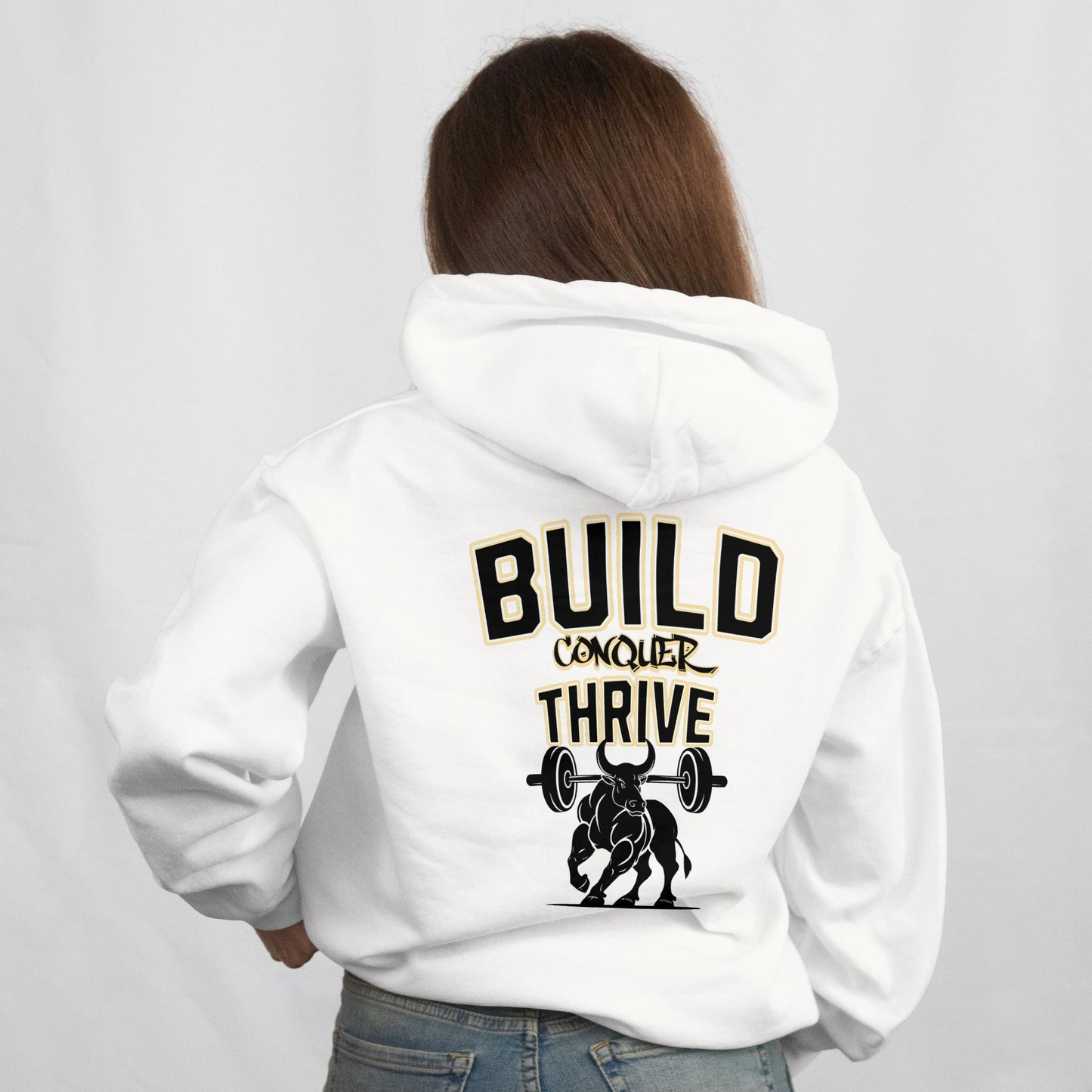 Person wearing a white hoodie with motivational text and graphic on the back against a plain background
