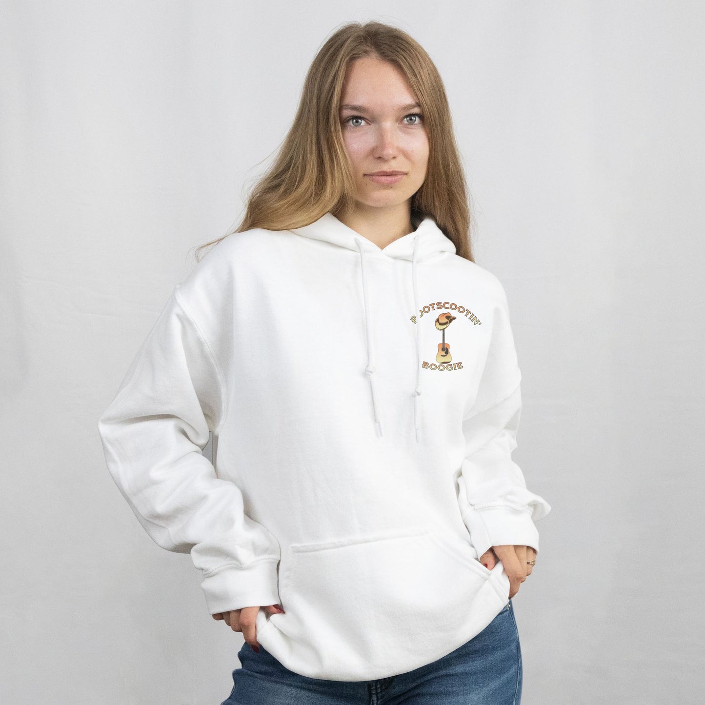 Person wearing a white hoodie with a logo on a plain background