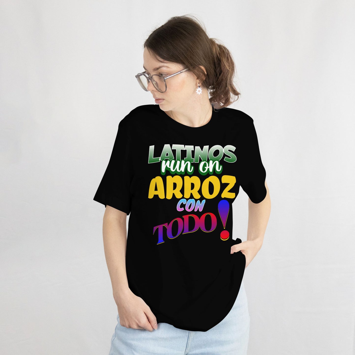 Person wearing a black t-shirt with colorful text on a white background