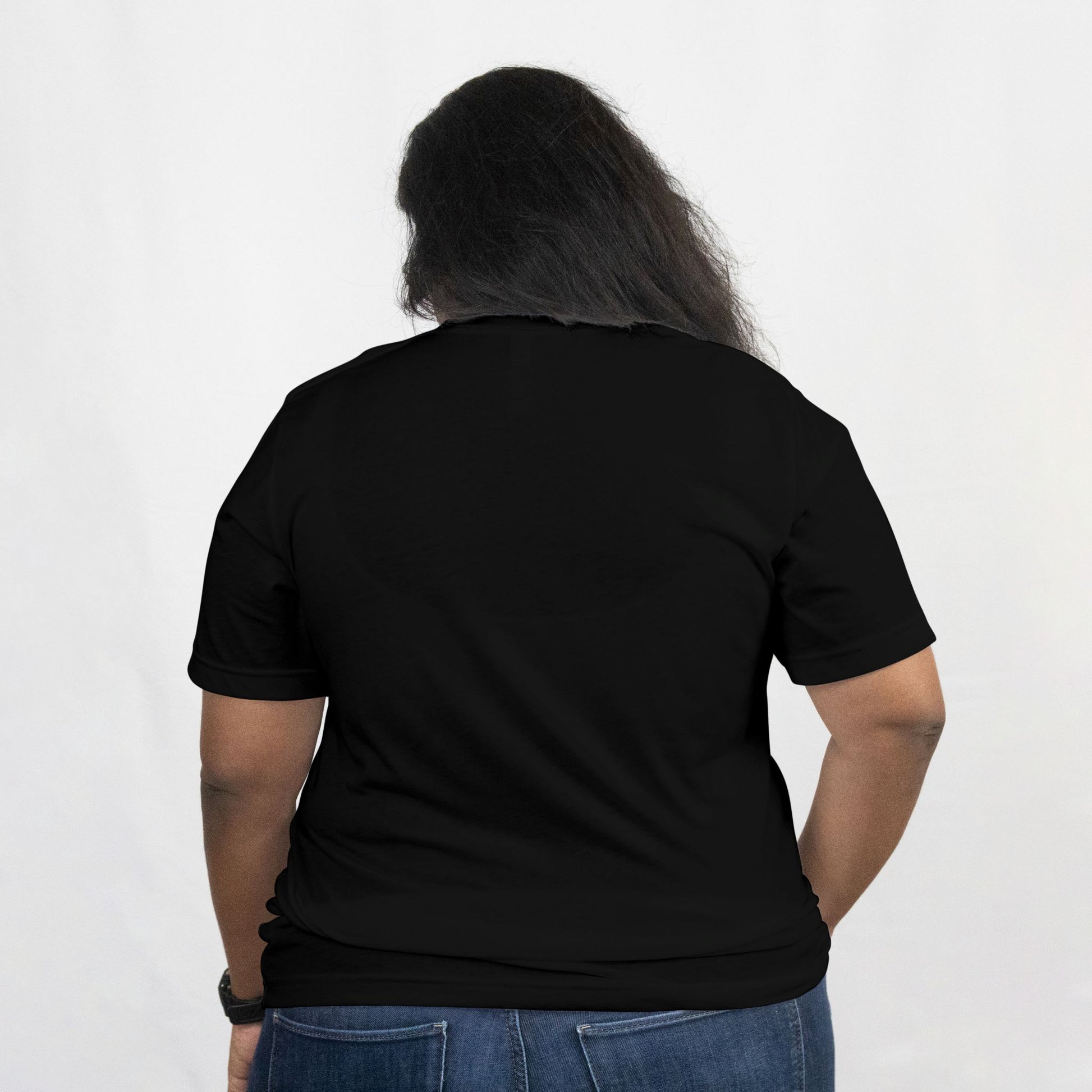 Person wearing a black t-shirt with a plain white background