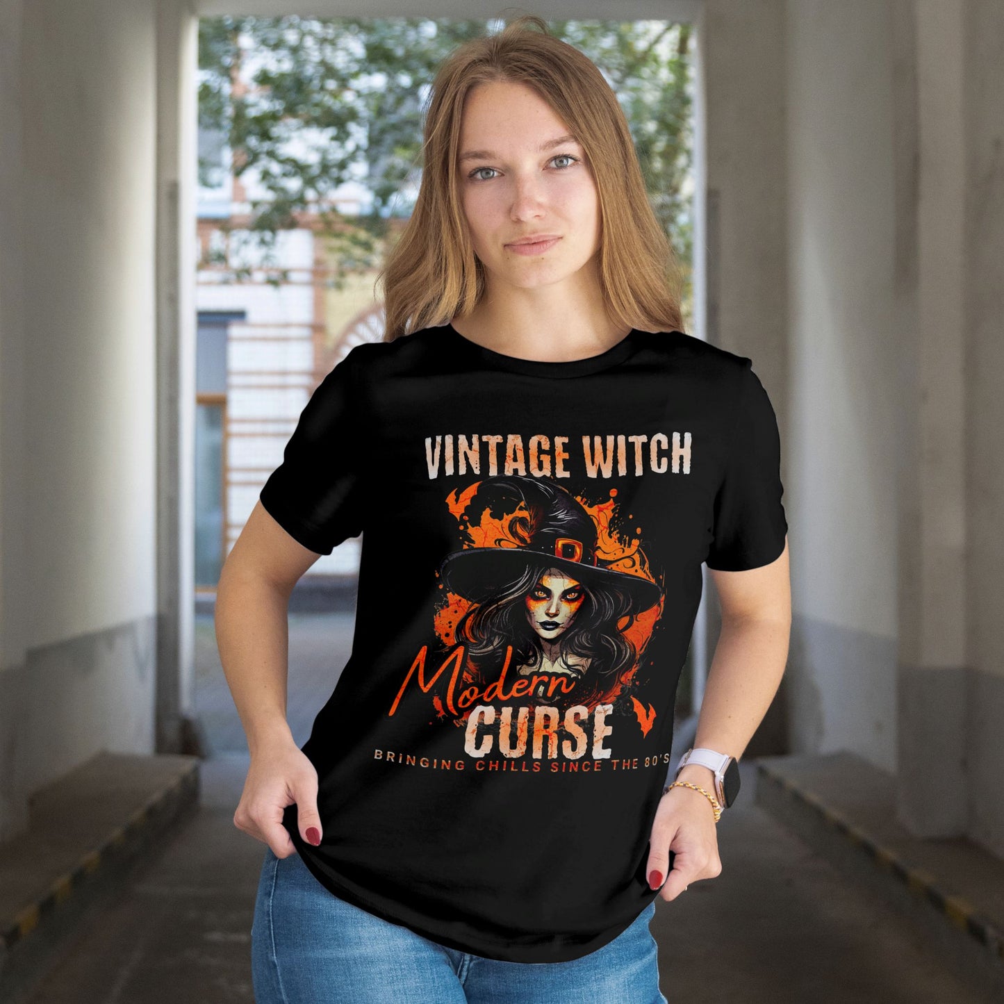 Person wearing a black t-shirt with 'Vintage Witch, Modern Curse' design.